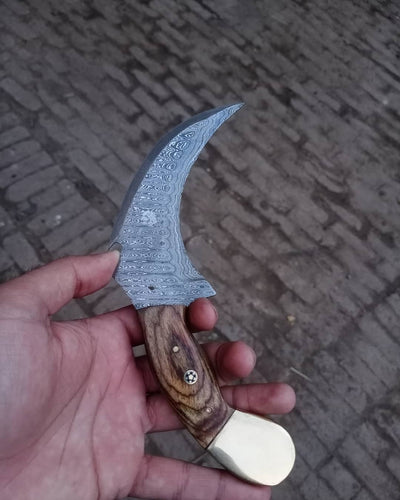 Damascus karambit knife..