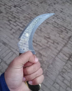 Damascus karambit knife..