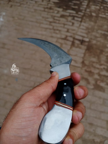 Karambit Knife with Black horn and Stainless steel handle.