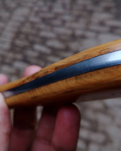 Damascus skinner knife with wood on handle.