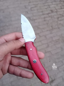 Handmade skinner knife with colour wood handle.